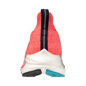 Back view of a pink sneaker with white sole on a white background