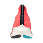 Back view of a pink sneaker with white sole on a white background