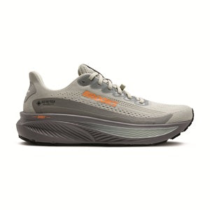 Gray running shoe with orange accents on a white background