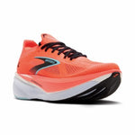Orange running shoe with black and white sole on a white background