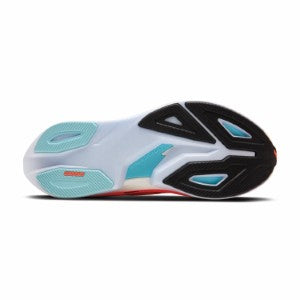 Close-up of a sports shoe sole with black, white, and blue design on a white background